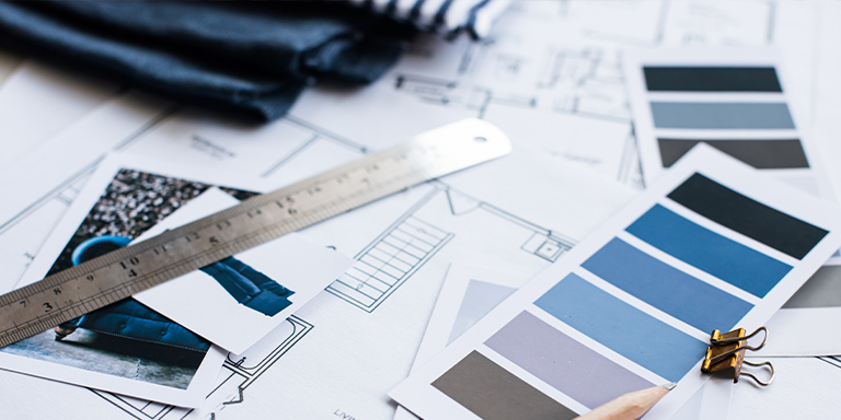 virtual-interior-design-services color swatches on a table with home plans and a ruler